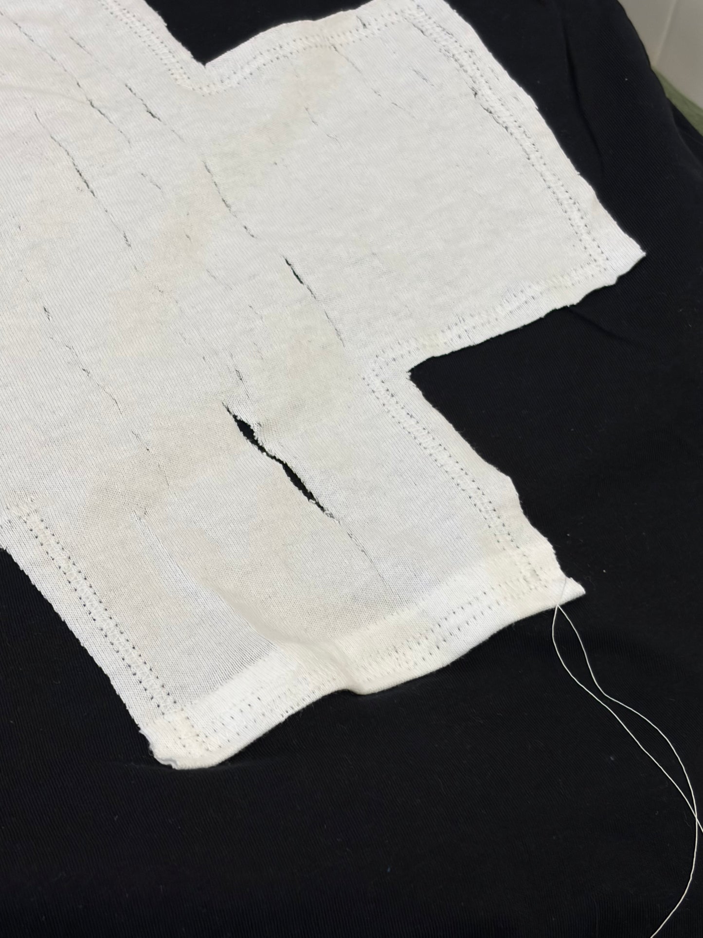 BLACK + WHITE CROSS BABY TEE